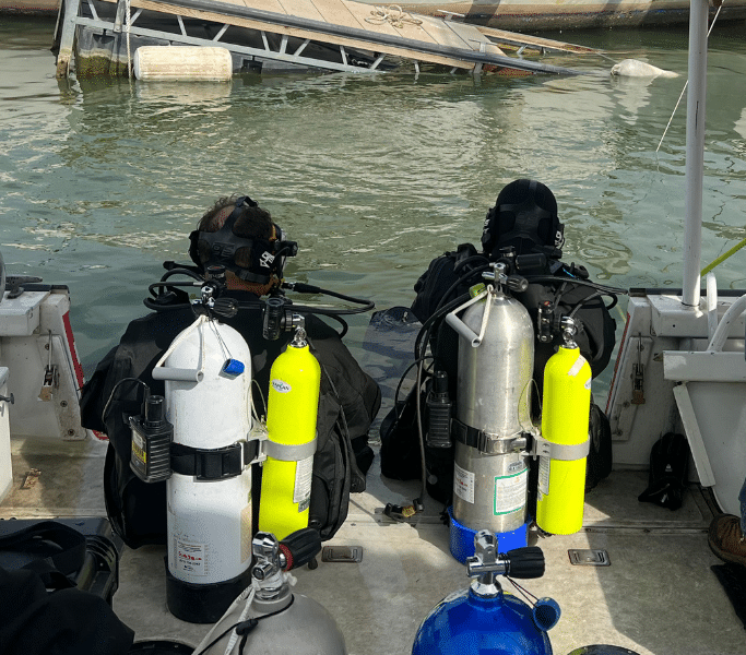 Divers preparing to enter the water